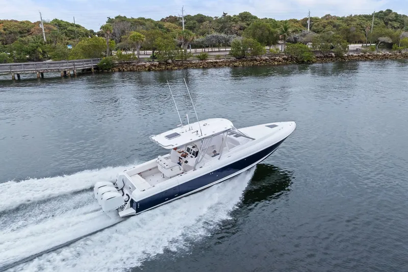 Slide: The Image of 2011 Intrepid 370 Cuddy cruising on a scenic waterway. - 2
