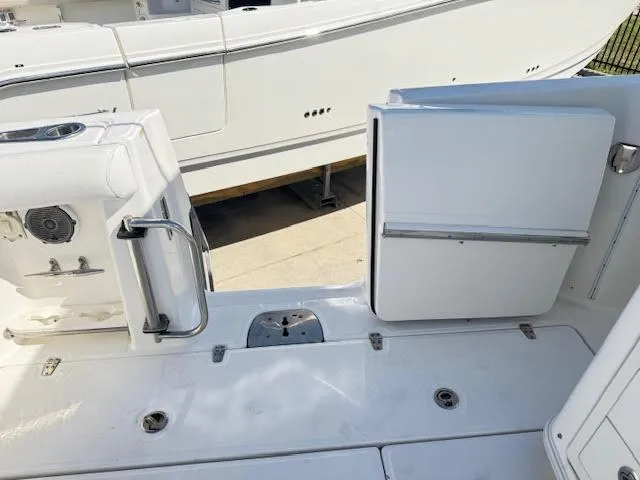 Slide: The Image of 2016 Boston Whaler 350 Outrage boat deck with open side door. - 33