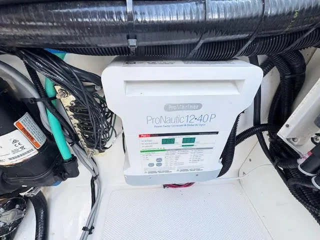 Slide: The Image of ProNautic 12-40P charger in 2016 Boston Whaler 350 Outrage boat's electrical compartment. - 48