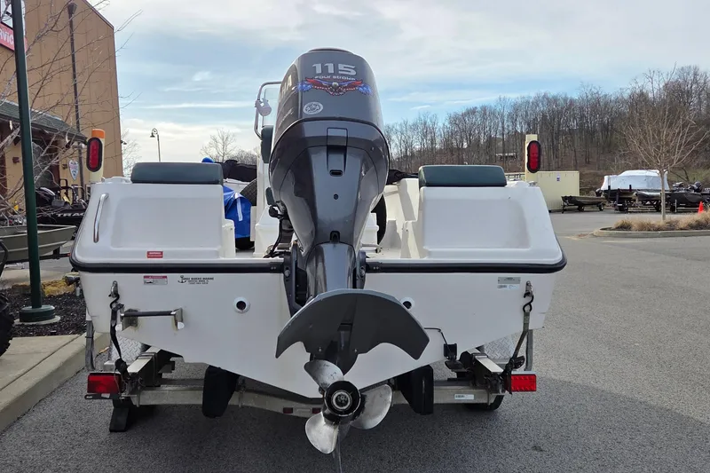 Slide: The Image of 2011 Cobia 194 Center Console boat with outboard motor on trailer. - 3