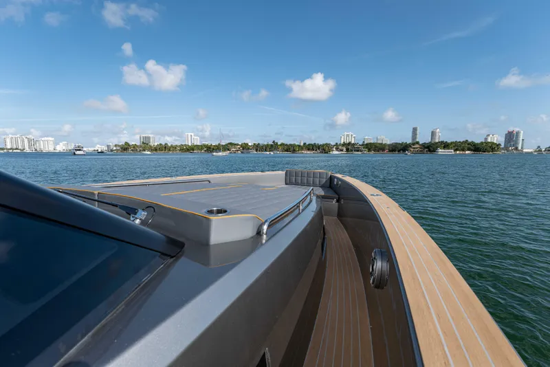 Slide: The Image of 2023 Pardo Yachts 43 cruising on calm waters with city skyline. - 15