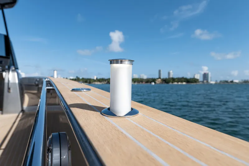 Slide: The Image of Pardo Yachts 43, 2023, at sea with city skyline in background. - 16