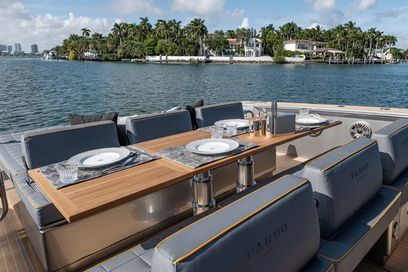 Slide: The Image of Luxurious dining area on a 2023 Pardo Yachts 43 with tropical coastal view. - 8