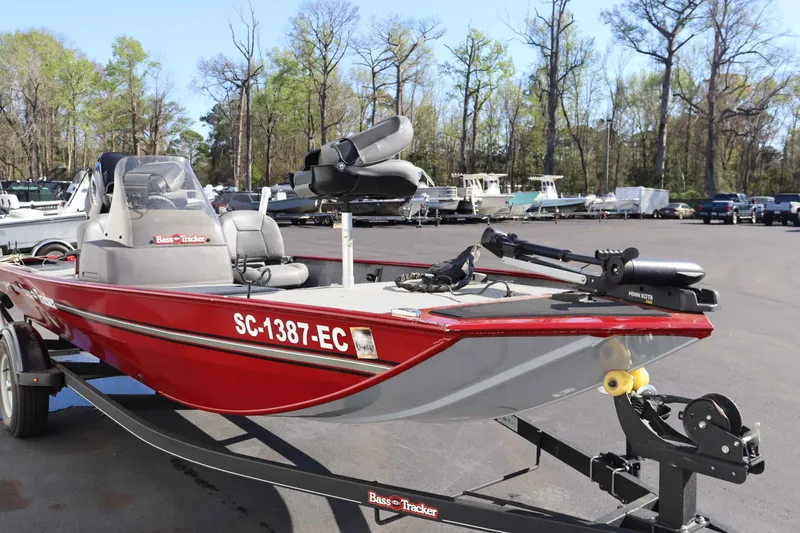 Slide: The Image of 2023 Tracker 17 BassCLSXL boat parked on trailer outdoors. - 3