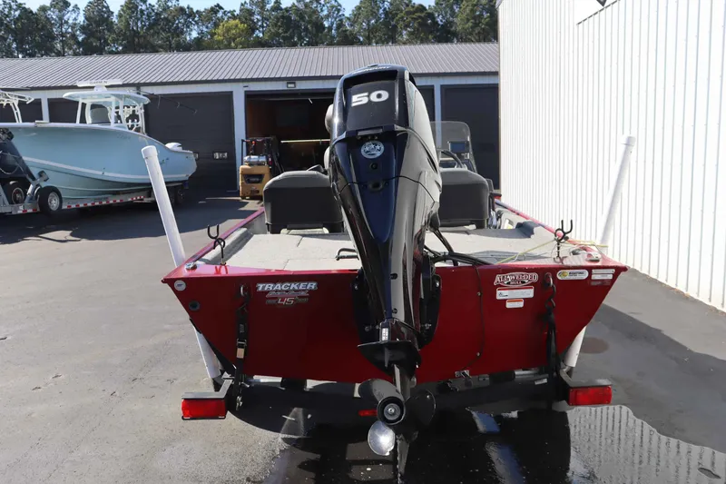 Slide: The Image of Red 2023 Tracker 17 BassCLSXL boat with outboard motor. - 5