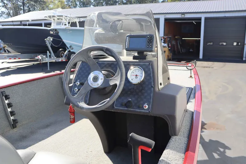 Slide: The Image of 2023 Tracker 17 BassCLSXL boat console with steering wheel and instruments. - 6