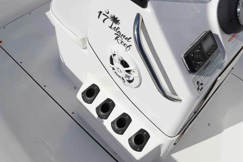 Slide: The Image of Sportsman 17 Island Reef 2015 boat console with speaker and controls. - 11