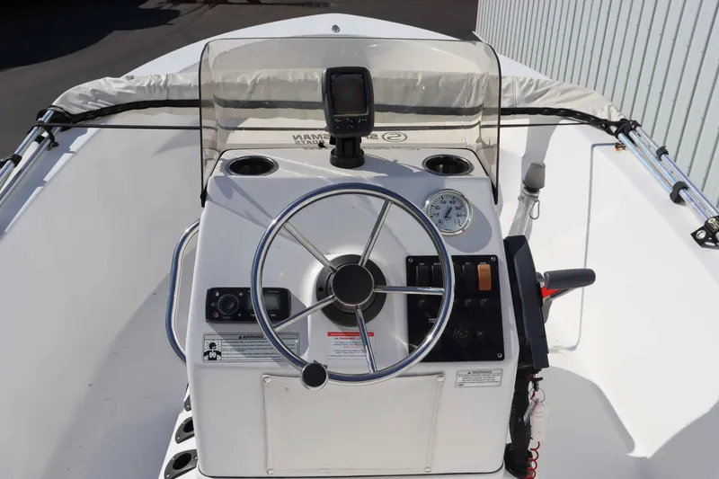 Slide: The Image of Helm console of a 2015 Sportsman 17 Island Reef boat. - 5