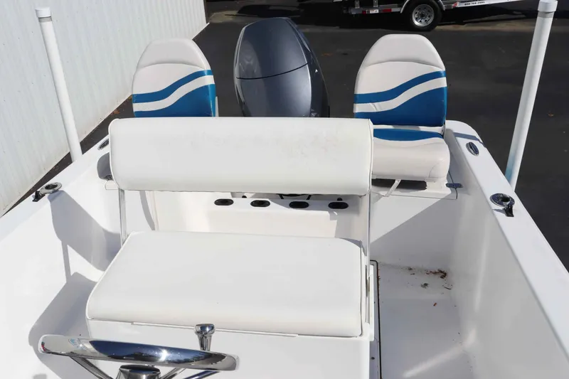 Slide: The Image of Interior of a 2015 Sportsman 17 Island Reef boat with blue seats. - 6