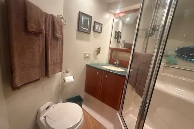 Slide: The Image of Bathroom interior of 2000 Silverton 453 Pilothouse Motor Yacht with shower and vanity. - 17