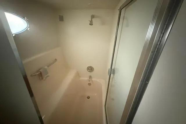 Slide: The Image of Bathroom interior of 2000 Silverton 453 Pilothouse Motor Yacht with shower and tub. - 3