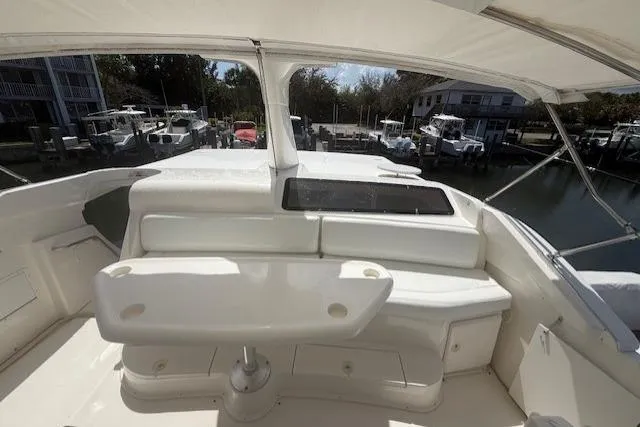 Slide: The Image of 2000 Silverton 453 Pilothouse Motor Yacht helm with marina view. - 4