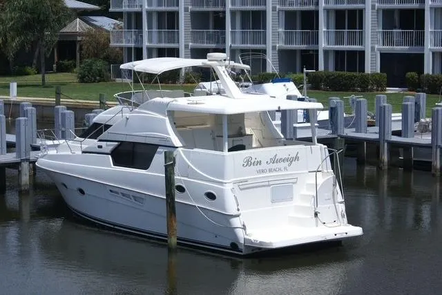 Slide: The Image of 2000 Silverton 453 Pilothouse Motor Yacht docked at marina, rear view. - 6
