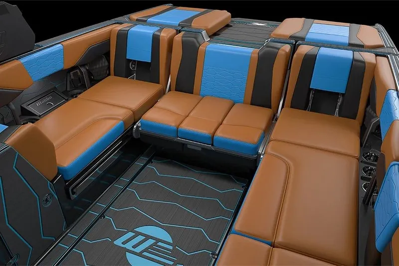 Slide: The Image of Manufacturer Provided Image: 2026 Malibu Wakesetter 24 MXZ interior with brown and blue seating, modern design. - 15