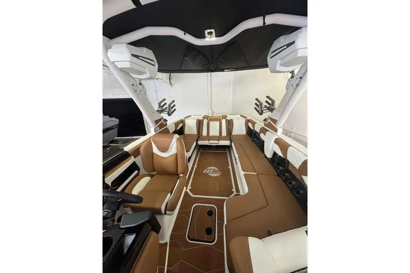 Slide: The Image of Interior of 2026 Malibu Wakesetter 24 MXZ boat with luxurious seating and modern design. - 5