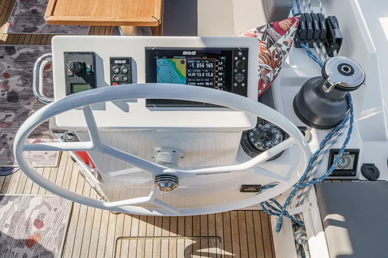 Slide: The Image of Steering wheel and navigation system on 2023 Bavaria C50 yacht deck. - 20