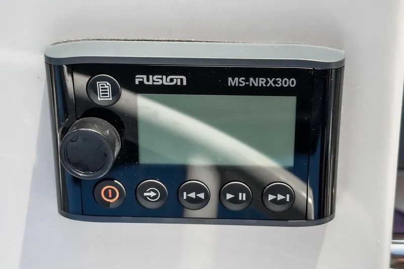Slide: The Image of Fusion MS-NRX300 marine stereo control on 2023 Bavaria C50 yacht dashboard. - 22