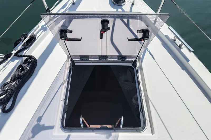 Slide: The Image of Open hatch on 2023 Bavaria C50 yacht deck, showing interior access. - 28