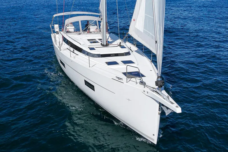 Slide: The Image of 2023 Bavaria C50 yacht sailing on open blue waters. - 4