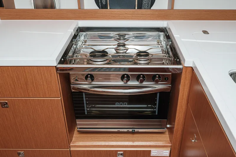 Slide: The Image of Modern kitchen stove in 2023 Bavaria C50 yacht, featuring sleek design and stainless steel finish. - 40