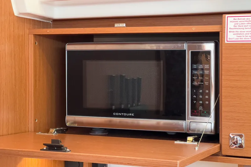 Slide: The Image of Microwave in Bavaria C50 yacht kitchen, 2023 model, with wooden cabinetry. - 42