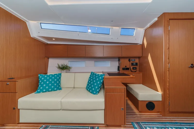 Slide: The Image of Luxurious interior of 2023 Bavaria C50 yacht with modern wood finish and skylights. - 44