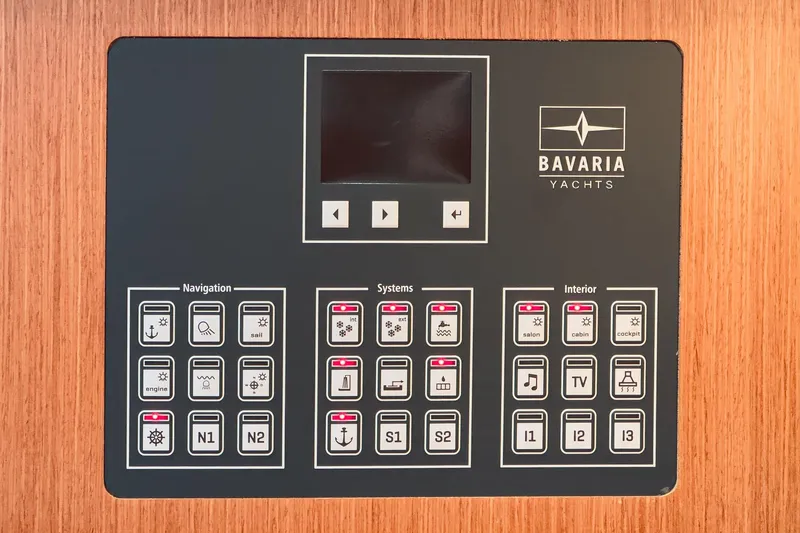 Slide: The Image of Control panel of a 2023 Bavaria C50 yacht, featuring navigation, systems, and interior controls. - 46