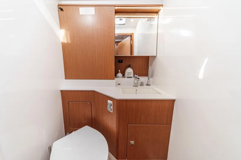 Slide: The Image of Modern bathroom interior of 2023 Bavaria C50 yacht with wooden cabinetry and sleek fixtures. - 57