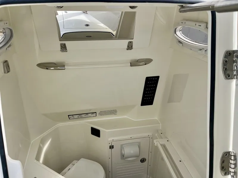 Slide: The Image of Interior of 2026 Cobia 285 Open Center Console with toilet. - 21