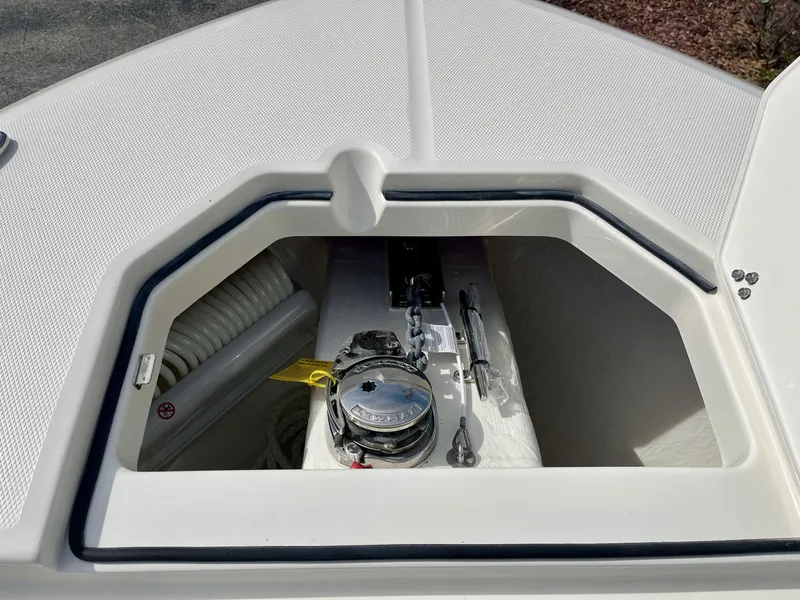 Slide: The Image of Cobia 285 Open Center Console 2026 anchor compartment detail view. - 18