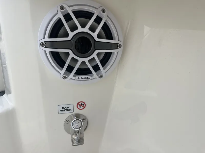 Slide: The Image of JL Audio speaker and raw water outlet on Cobia 285 Open 2026. - 35