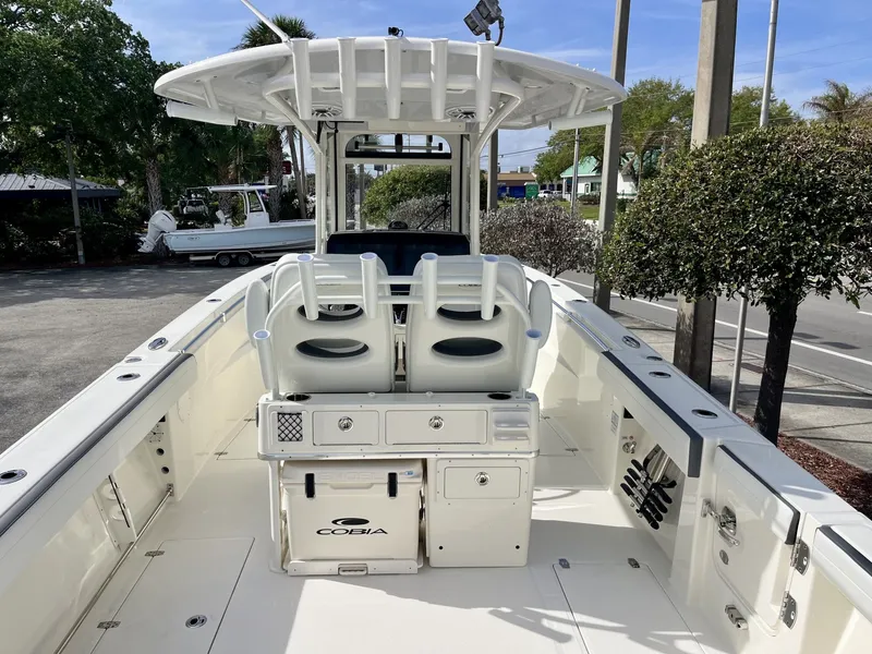 Slide: The Image of 2026 Cobia 285 Open Center Console, sleek boat dock design. - 10