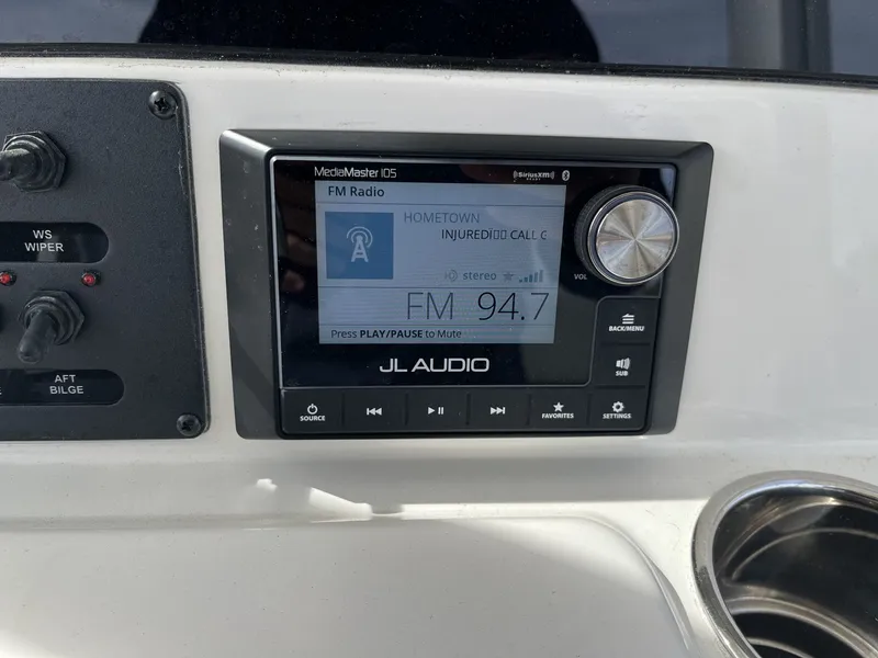 Slide: The Image of JL Audio radio on Cobia 285 Open Center Console 2026. - 13