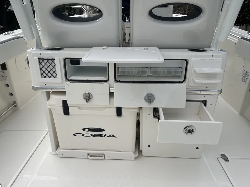 Slide: The Image of Cobia 285 Open Center Console 2026 with storage and cooler. - 30