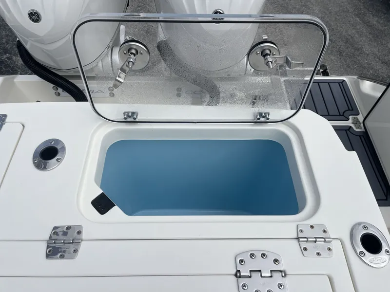 Slide: The Image of Cobia 285 Open Center Console 2026 with open storage compartment. - 31