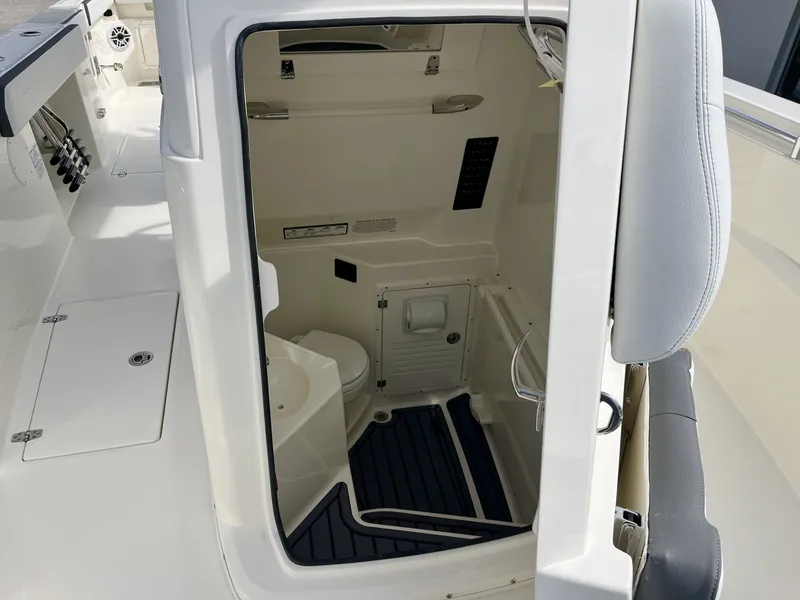 Slide: The Image of Interior of 2026 Cobia 285 Open Center Console with toilet. - 19