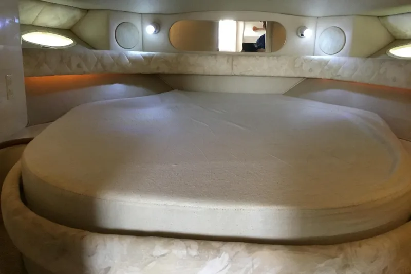 Slide: The Image of Interior cabin of 1995 Sea Ray Sundancer 370 with circular bed and ambient lighting. - 14