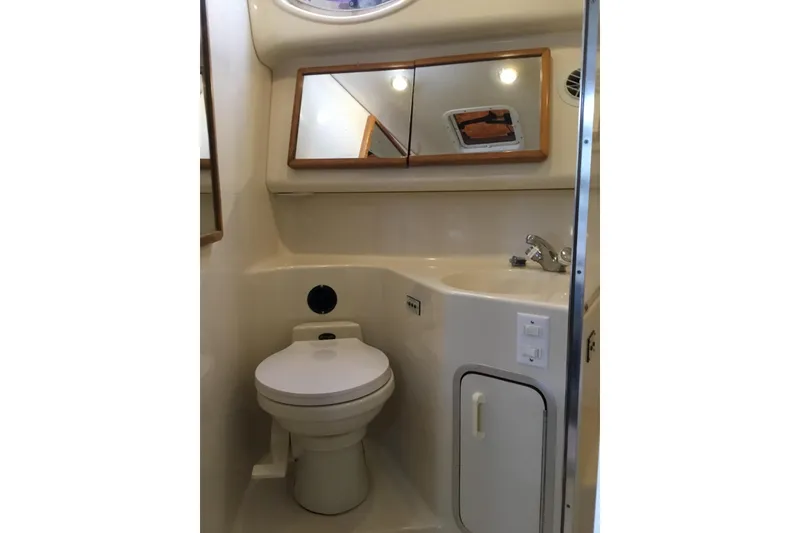 Slide: The Image of Bathroom interior of 1995 Sea Ray Sundancer 370 yacht, featuring toilet and sink. - 16