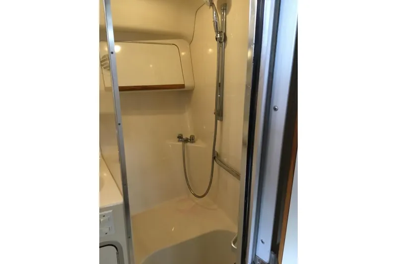 Slide: The Image of Shower area in 1995 Sea Ray Sundancer 370 yacht, featuring a handheld showerhead. - 17