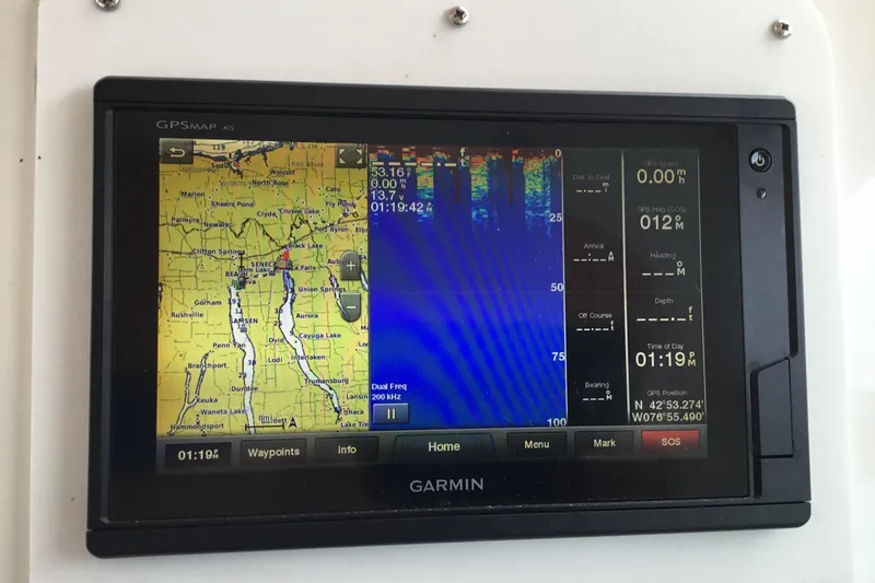Slide: The Image of Garmin GPSMAP X5 displaying navigation and sonar data on a Sea Ray Sundancer 370, 1995 model. - 5