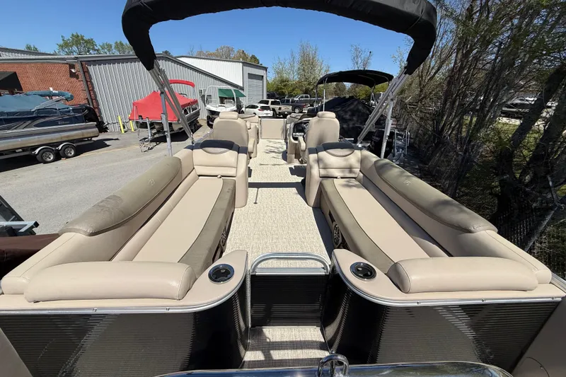 Slide: The Image of 2020 Avalon Catalina Quad Lounge 25' pontoon boat with beige seating and canopy. - 11