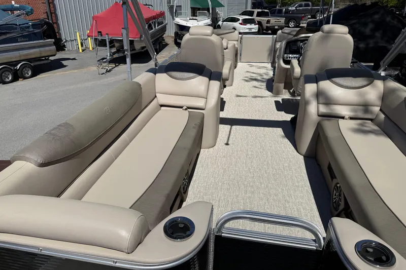Slide: The Image of 2020 Avalon Catalina Quad Lounge 25' pontoon boat interior with beige seating. - 13