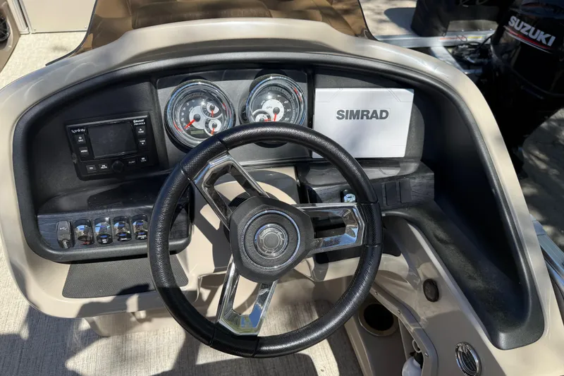Slide: The Image of Steering console of 2020 Avalon Catalina Quad Lounge boat with Simrad display. - 17