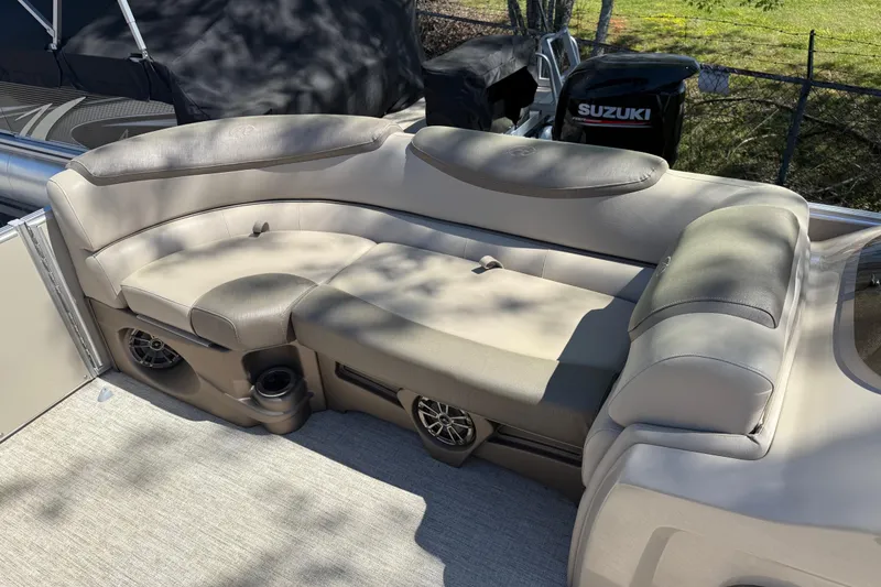 Slide: The Image of 2020 Avalon Catalina Quad Lounge 25' boat interior with plush seating and cup holders. - 19