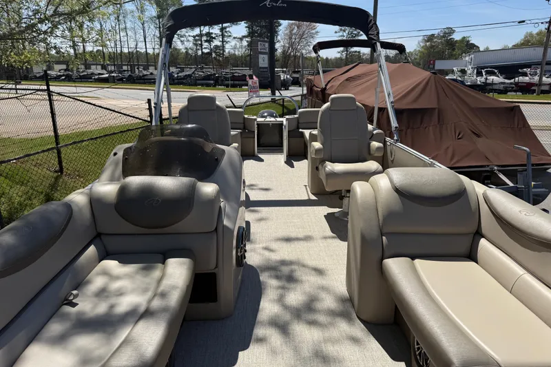 Slide: The Image of 2020 Avalon Catalina Quad Lounge 25' pontoon boat with beige seating and canopy. - 4