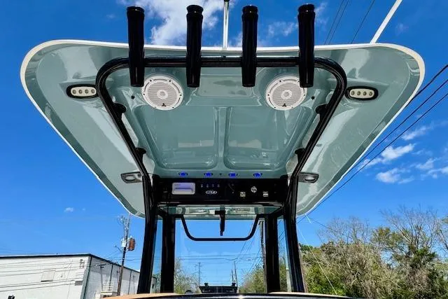 Slide: The Image of 2022 Sea Hunt Ultra 255 SE boat top view with rod holders and speakers. - 11