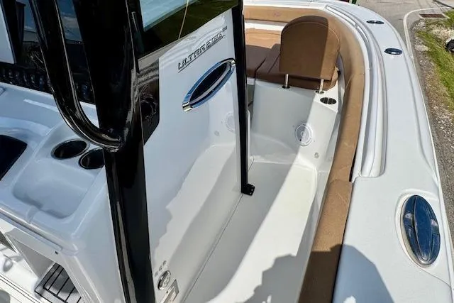 Slide: The Image of 2022 Sea Hunt Ultra 255 SE boat interior with seating and console details. - 15