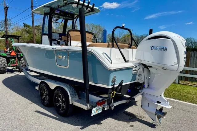 Slide: The Image of 2022 Sea Hunt Ultra 255 SE boat on trailer with Yamaha outboard motor. - 2