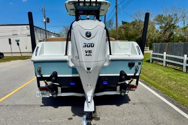 Slide: The Image of 2022 Sea Hunt Ultra 255 SE boat with Yamaha 300 V6 engine on a road. - 3