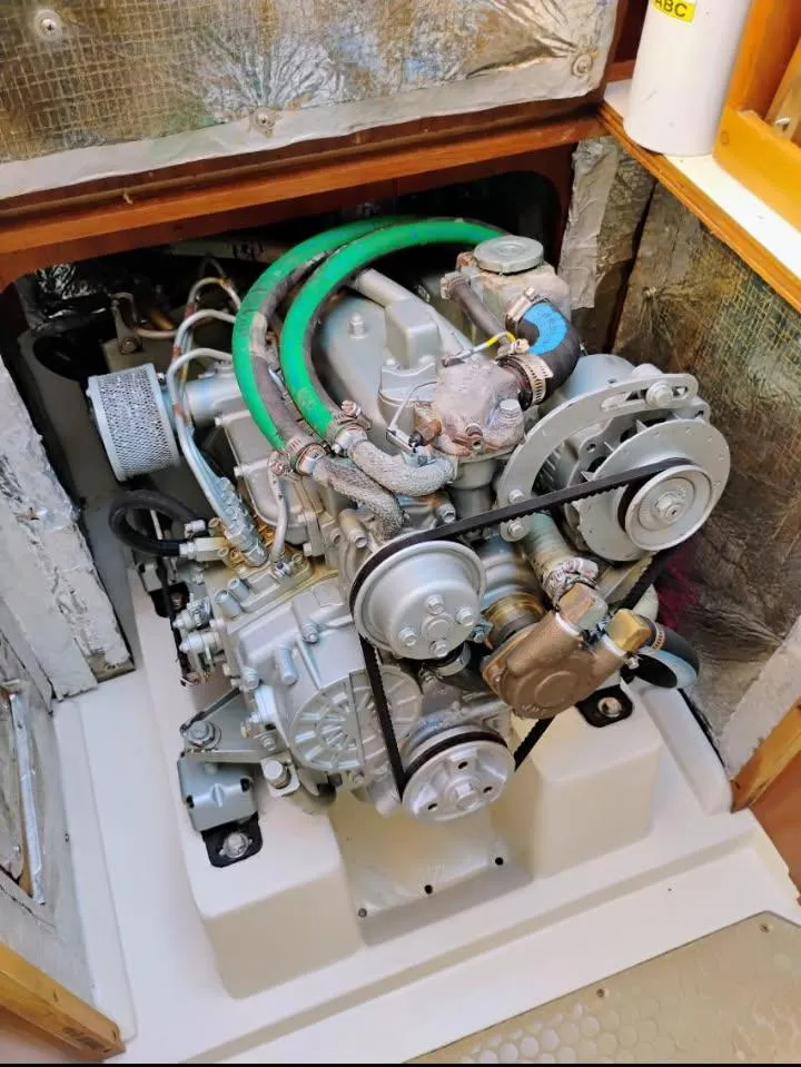Slide: The Image of Engine compartment of a 2002 Catalina 34 Mark II sailboat, showcasing mechanical components. - 11